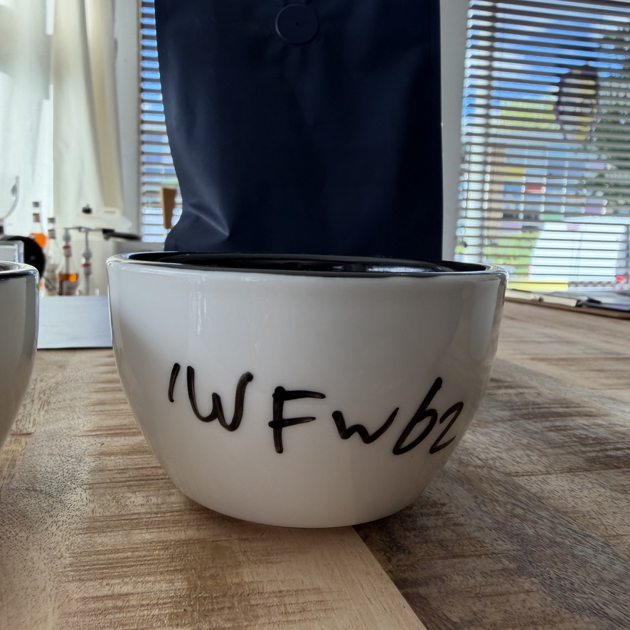 Cupping bowl marked IWFW62 for Fully Washed roast profile